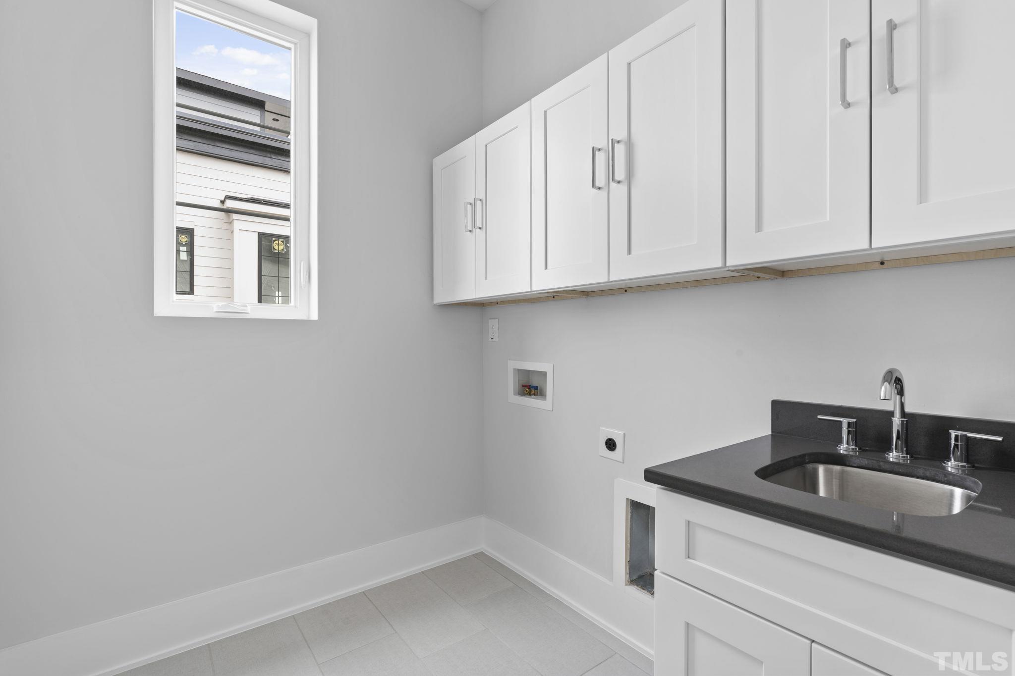 407 West Lenoir Street Raleigh, NC 27601 - Photo 29 of 42 a kitchen with stainless steel appliances granite countertop white cabinets sink and dishwasher