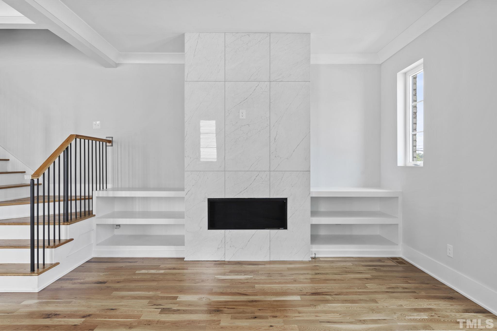 407 West Lenoir Street Raleigh, NC 27601 - Photo 10 of 42 a view of an empty room with wooden floor and a window