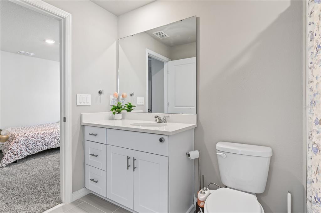 32502 Limitless Place Wesley Chapel, FL 33545 - Photo 30 of 67 a bathroom with a sink toilet and shower