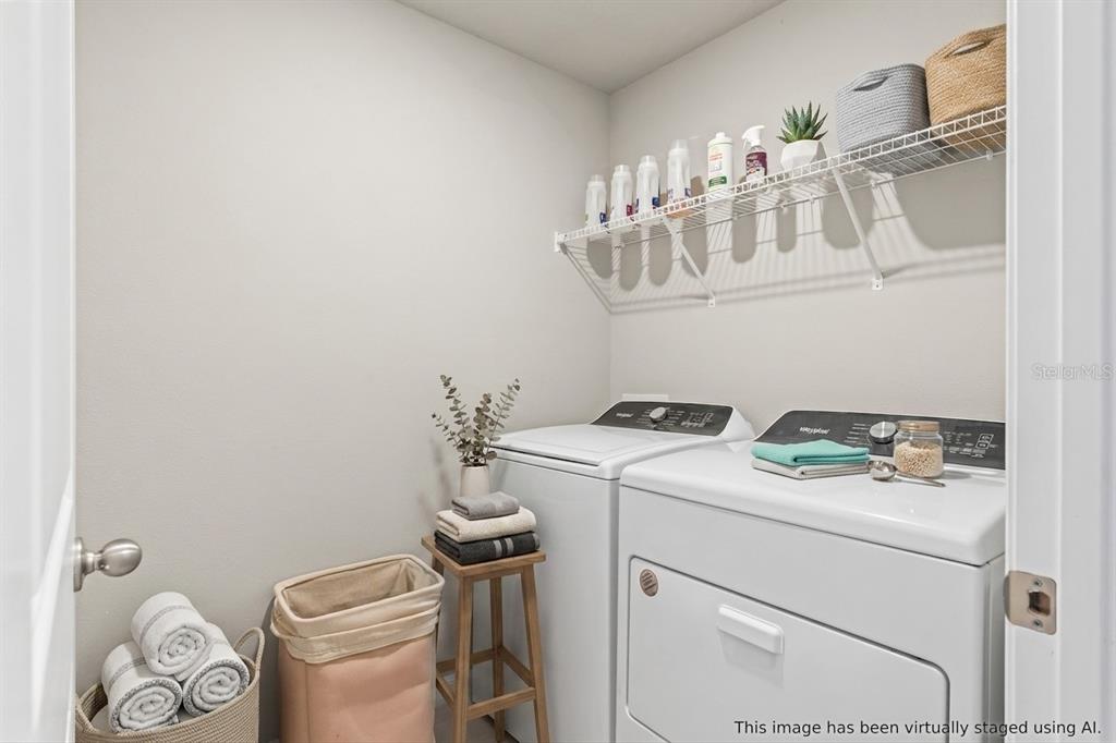 32502 Limitless Place Wesley Chapel, FL 33545 - Photo 35 of 67 a bathroom with a sink a toilet and a mirror