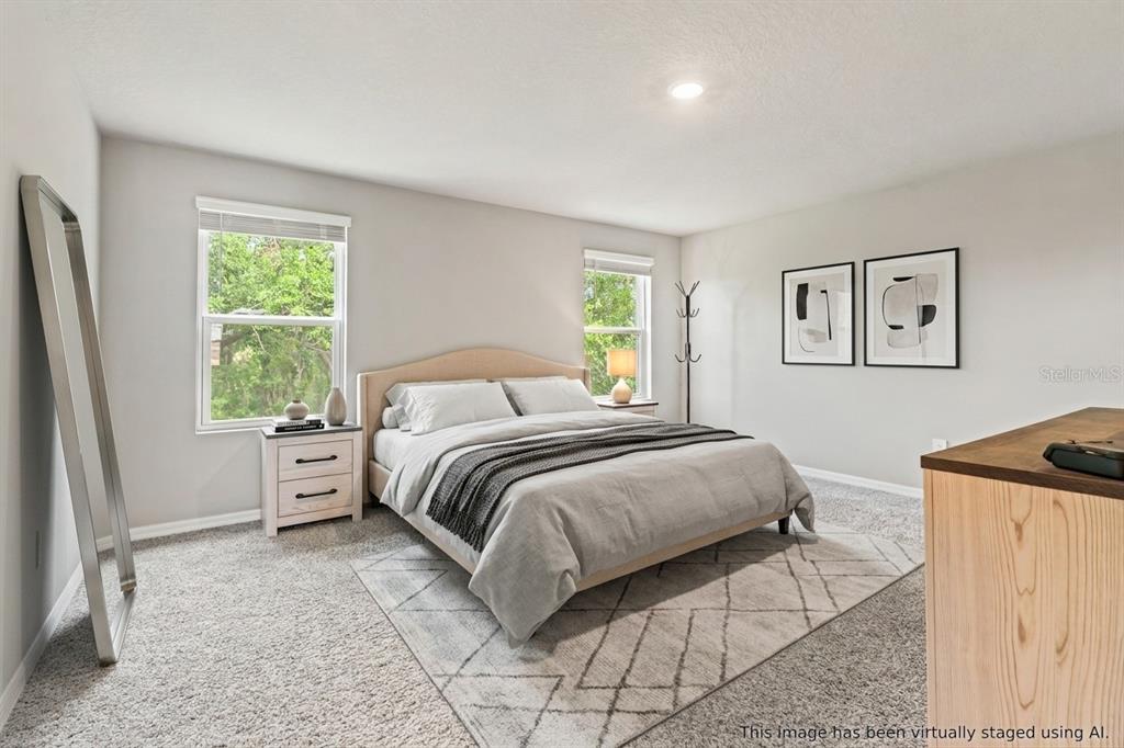 32502 Limitless Place Wesley Chapel, FL 33545 - Photo 39 of 67 a bedroom with a bed and a window