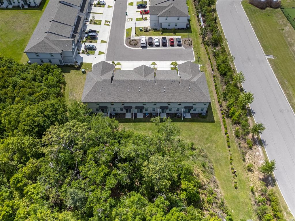 32502 Limitless Place Wesley Chapel, FL 33545 - Photo 49 of 67 an aerial view of a house with a yard basket ball court and outdoor seating