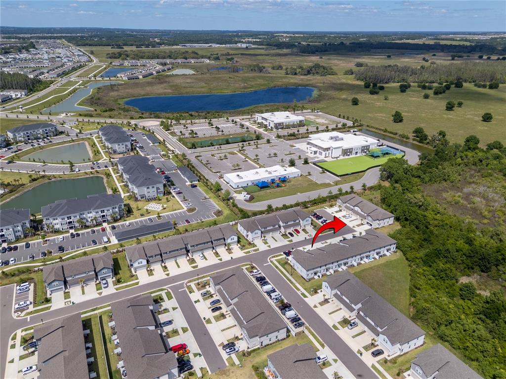 32502 Limitless Place Wesley Chapel, FL 33545 - Photo 51 of 67 an aerial view of a city with ocean view