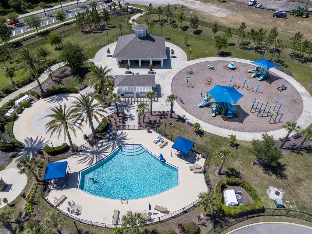 32502 Limitless Place Wesley Chapel, FL 33545 - Photo 62 of 67 an aerial view of a house with outdoor space and parking