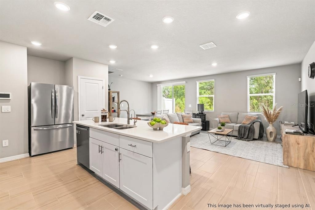 32502 Limitless Place Wesley Chapel, FL 33545 - Photo 8 of 67 a kitchen with a sink appliances and cabinets