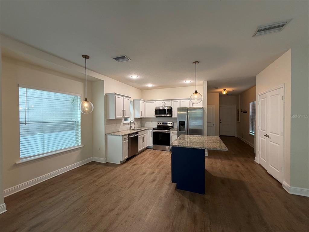 1736 West Walnut Street Tampa, FL 33607 - Photo 3 of 22 a view of kitchen with sink and wooden floor