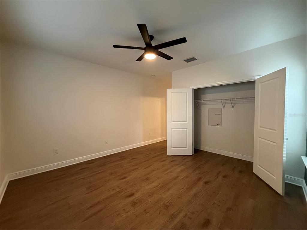 1736 West Walnut Street Tampa, FL 33607 - Photo 9 of 22 an empty room with closet and a ceiling fan