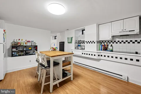 a kitchen with stainless steel appliances a stove a sink and a refrigerator