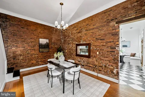 a view of a livingroom with furniture and a flat screen tv