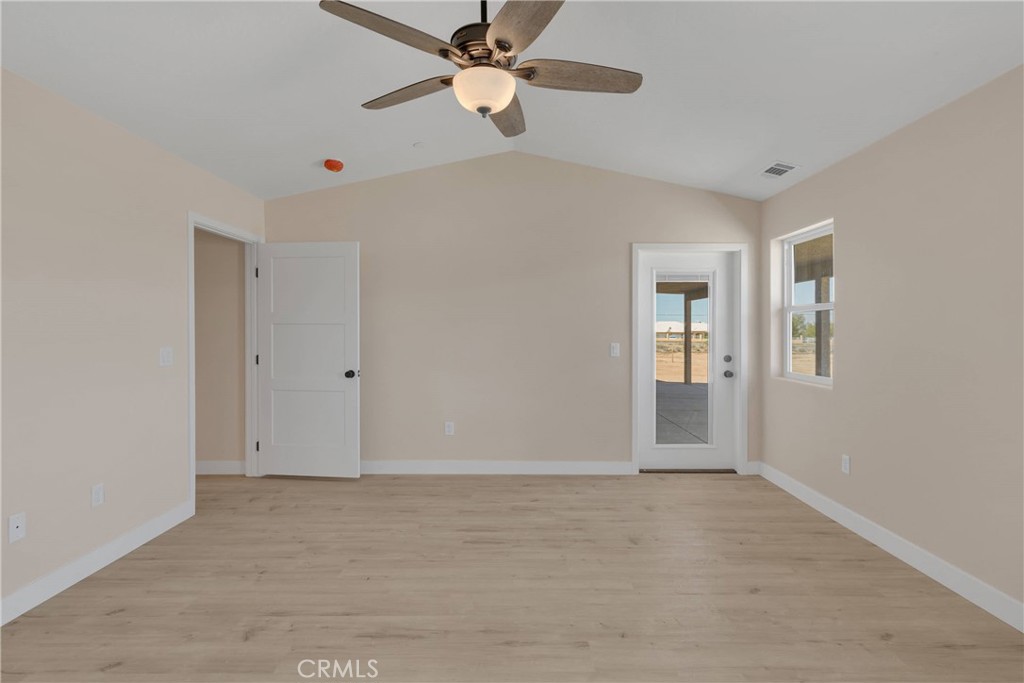 10647 Central Road Apple Valley, CA 92308 - Photo 14 of 27 an empty room with closet and windows