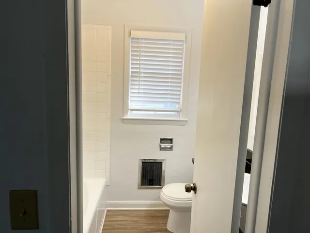 a bathroom with a toilet and a sink