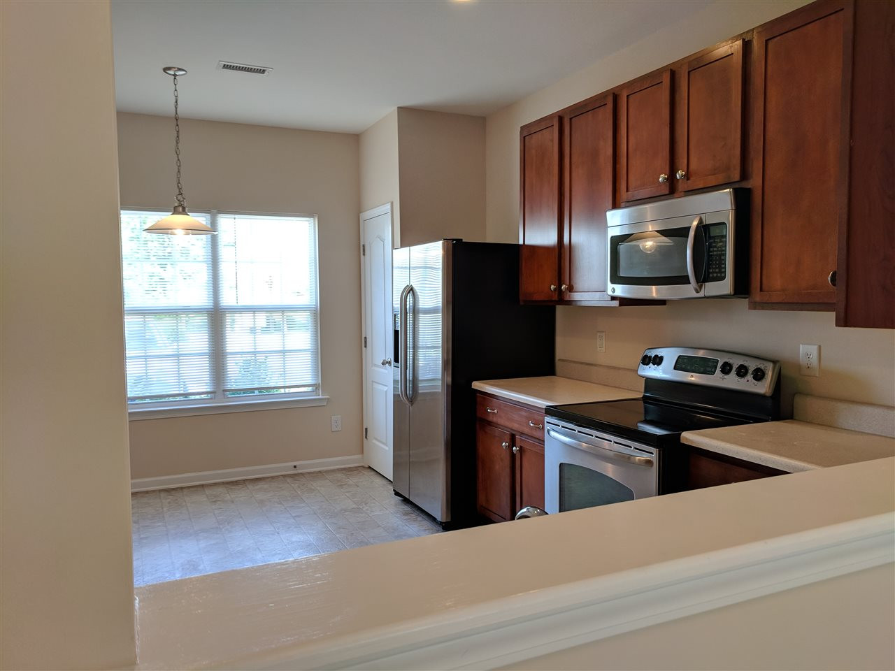 3124 Binghampton Lane Raleigh, NC 27604 - Photo 5 of 19 Cut through kitchen to the living area, great for entertaining! Kitchen