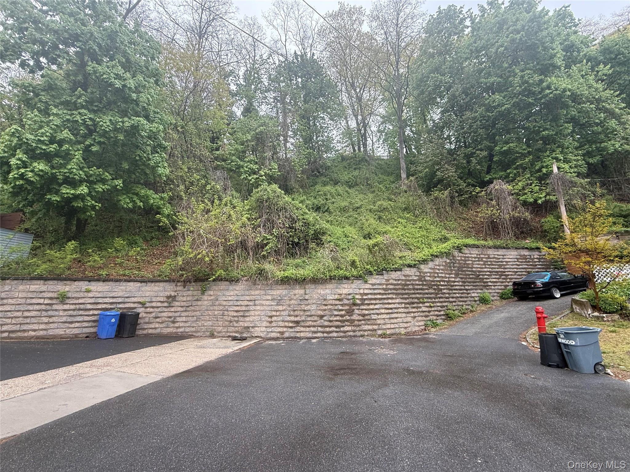 103 Firwood Road Manorhaven, NY 11050 - Photo 4 of 5 a view of a road with fire pit
