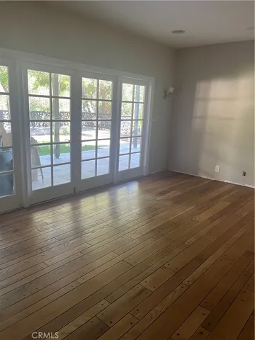 a kitchen with kitchen island granite countertop wooden cabinets a sink and stainless steel appliances