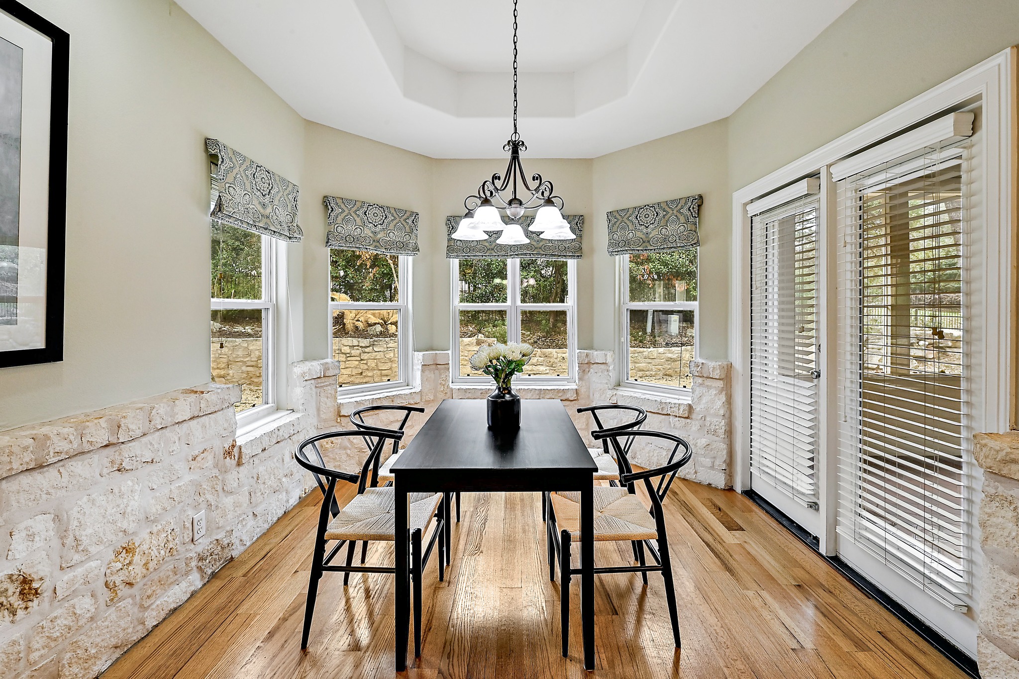 22 Hedgebrook Way The Hills, TX 78738 - Photo 12 of 40 a view of a dining room with furniture window and wooden floor