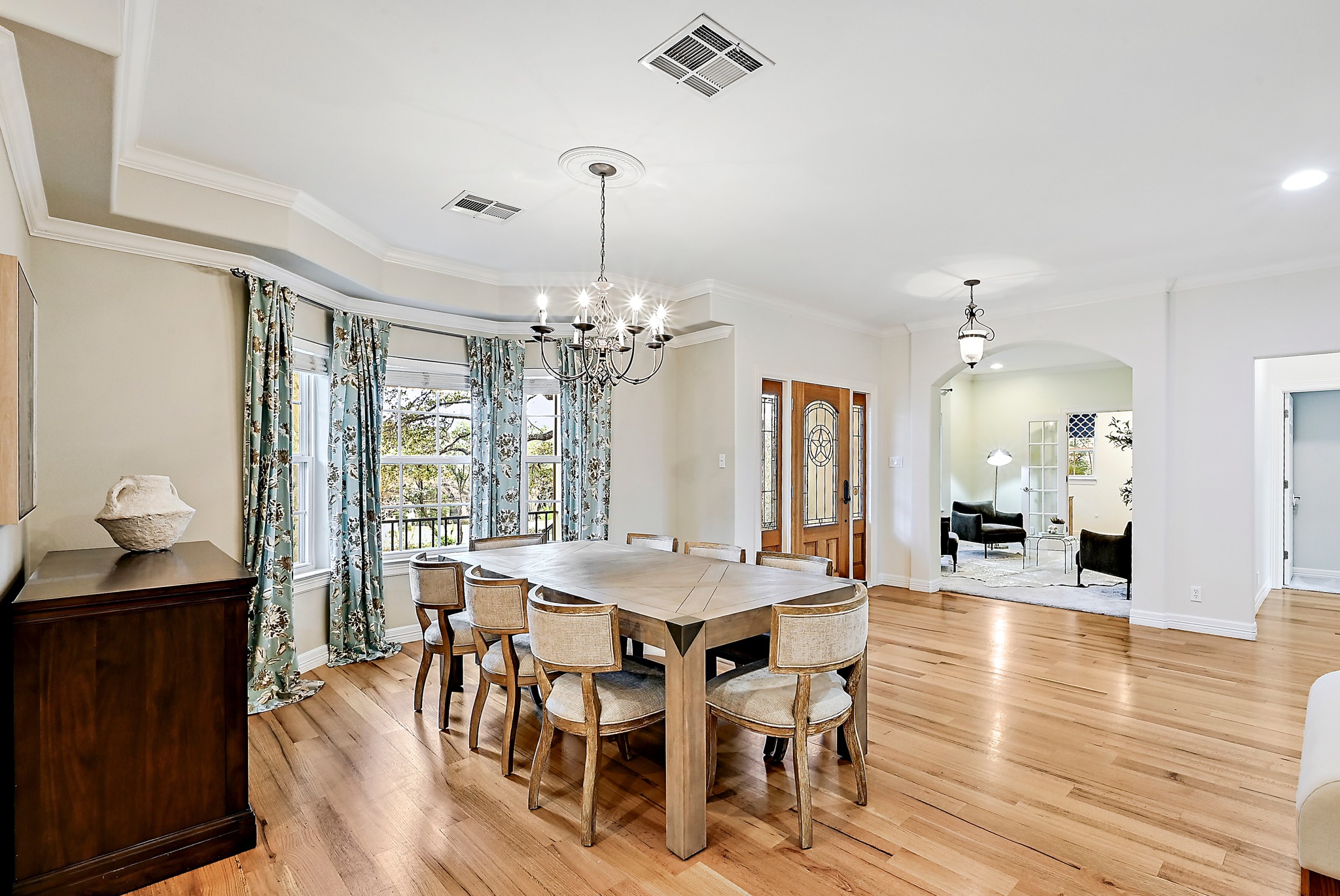22 Hedgebrook Way The Hills, TX 78738 - Photo 13 of 40 a view of a dining room with furniture window and wooden floor