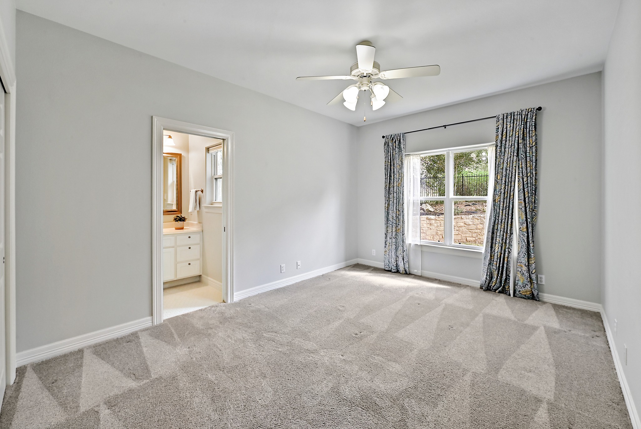 22 Hedgebrook Way The Hills, TX 78738 - Photo 18 of 40 a view of an empty room with chandelier fan