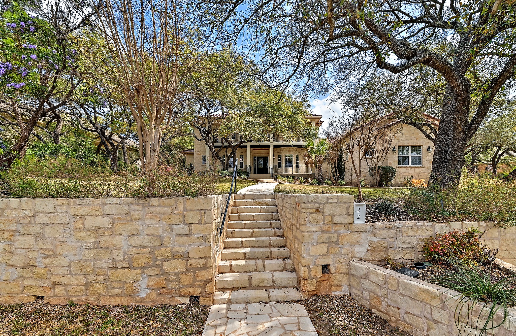 22 Hedgebrook Way The Hills, TX 78738 - Photo 2 of 40 a front view of a house with a yard