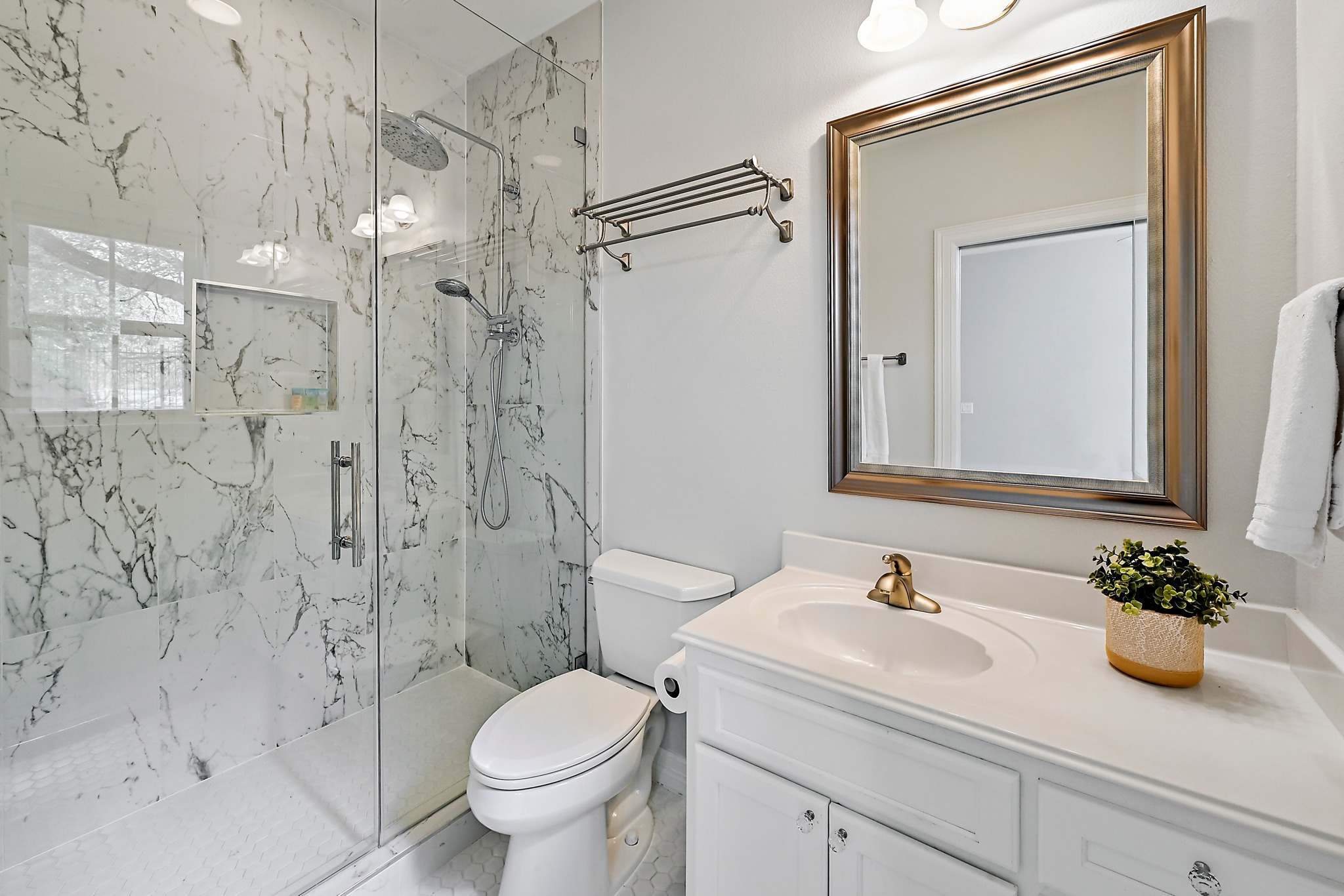 22 Hedgebrook Way The Hills, TX 78738 - Photo 19 of 40 a bathroom with a sink a toilet and shower