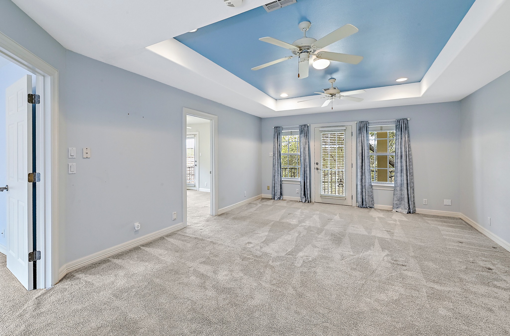 22 Hedgebrook Way The Hills, TX 78738 - Photo 21 of 40 en view interior of a house with a ceiling fan and windows