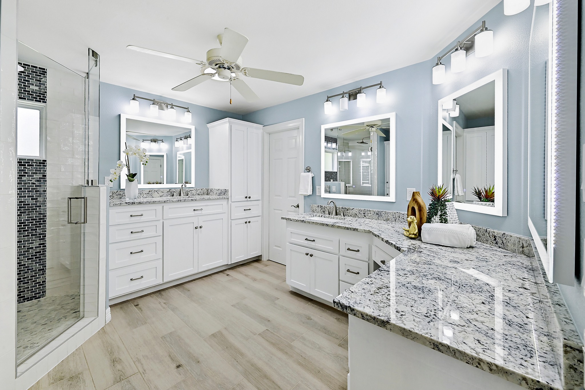 22 Hedgebrook Way The Hills, TX 78738 - Photo 24 of 40 a spacious bathroom with a granite countertop sink mirror and a