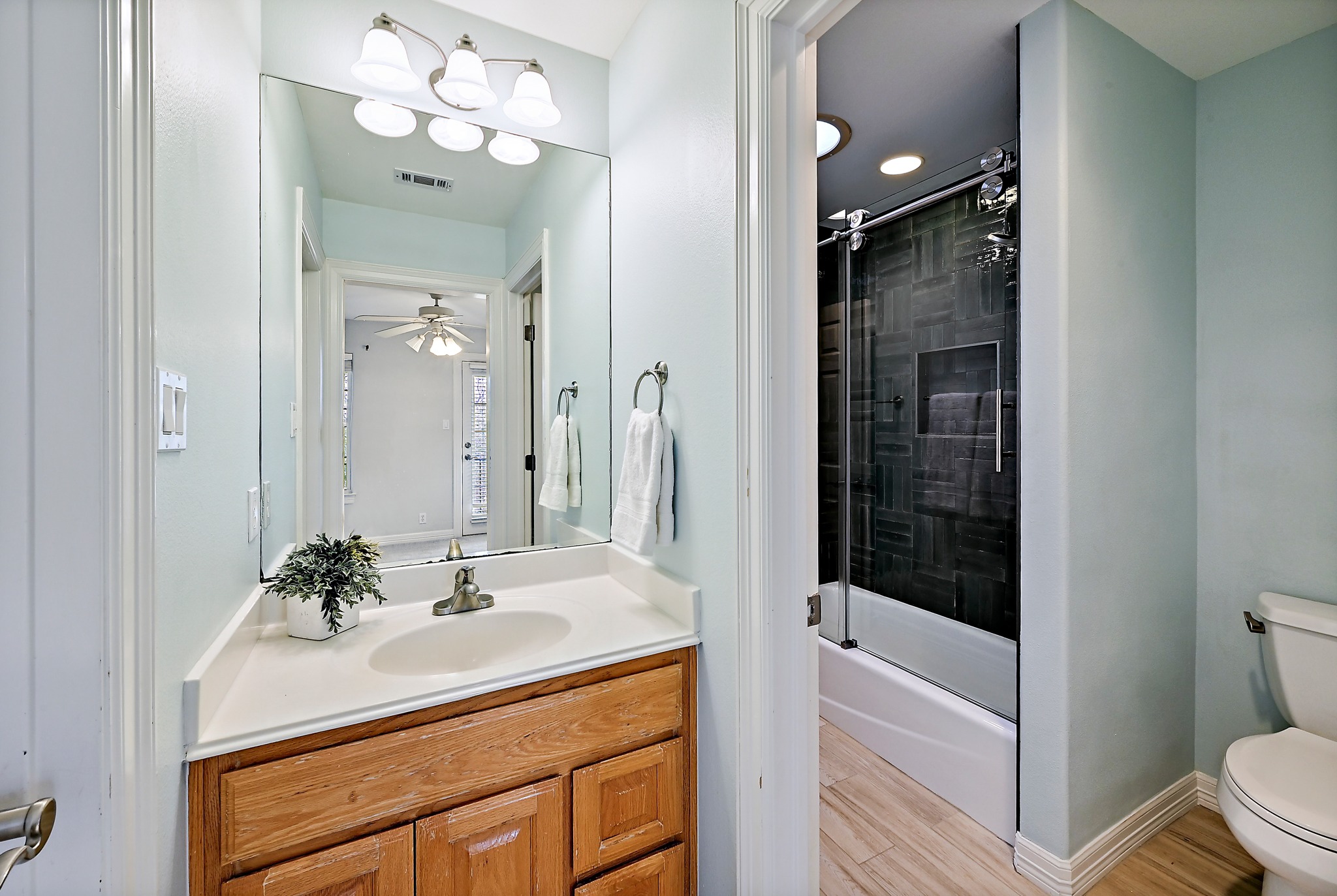 22 Hedgebrook Way The Hills, TX 78738 - Photo 28 of 40 a bathroom with a sink vanity granite tub and shower