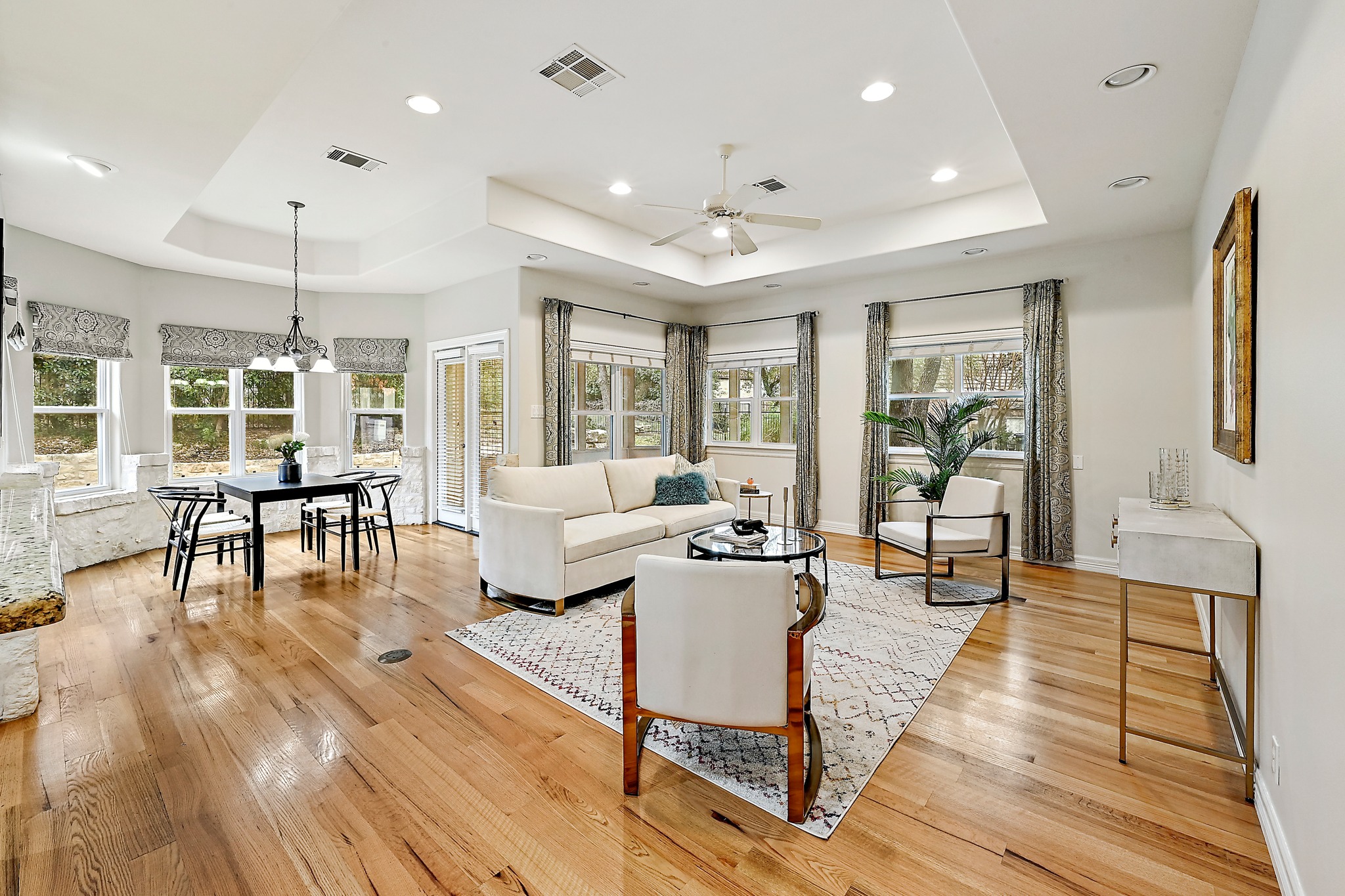 22 Hedgebrook Way The Hills, TX 78738 - Photo 5 of 40 a living room with furniture and a wooden floor
