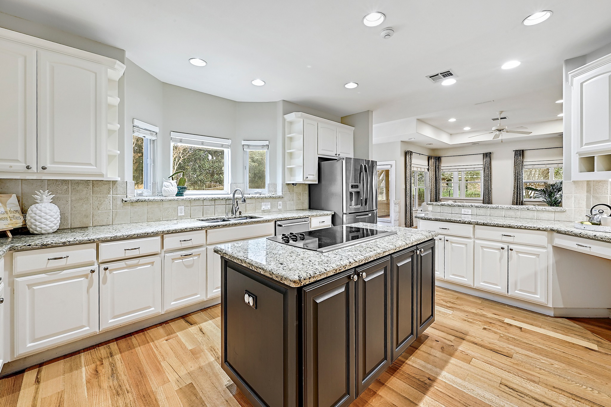 22 Hedgebrook Way The Hills, TX 78738 - Photo 8 of 40 a kitchen with stainless steel appliances granite countertop a sink stove and cabinets