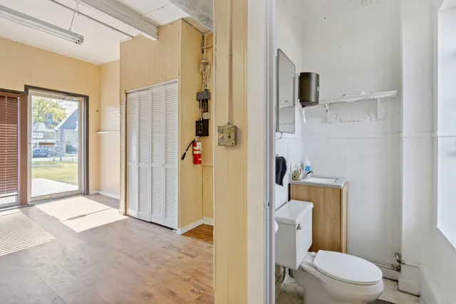 a bathroom with a toilet and a shower