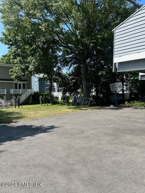 48 Pemberwick Road, Unit 3 Greenwich, CT 06831 - Photo 15 of 18 a view of a house with a yard