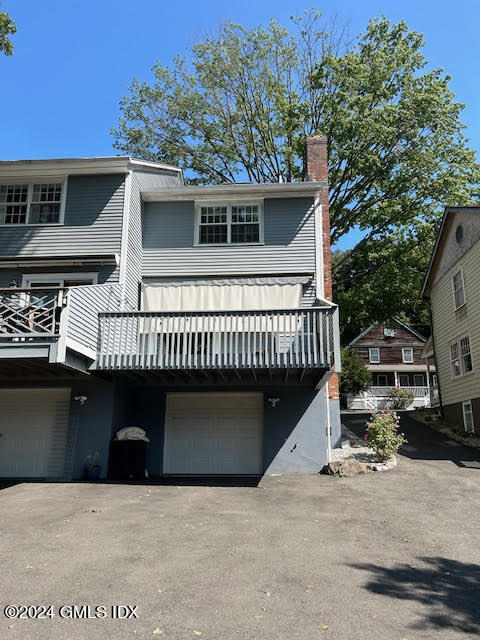 48 Pemberwick Road, Unit 3 Greenwich, CT 06831 - Photo 18 of 18 a terrace with a table and chairs