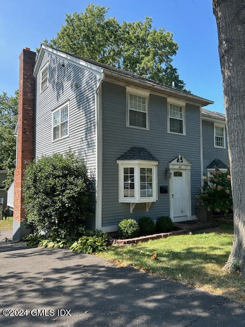 48 Pemberwick Road, Unit 3 Greenwich, CT 06831 - Photo 2 of 18 a front view of house with yard