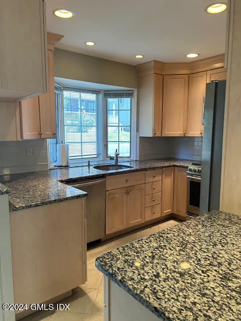 48 Pemberwick Road, Unit 3 Greenwich, CT 06831 - Photo 6 of 18 a kitchen with stainless steel appliances granite countertop a stove a sink and a microwave