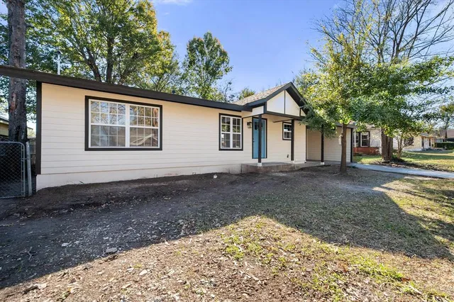 a backyard of a house with lots of green space