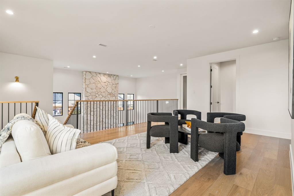 702 Mockingbird Lane Coppell, TX 75019 - Photo 22 of 32 Living area with light wood-style flooring and recessed lighting