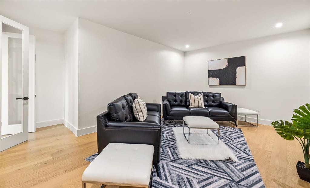 702 Mockingbird Lane Coppell, TX 75019 - Photo 26 of 32 Living room featuring light wood finished floors and recessed lighting