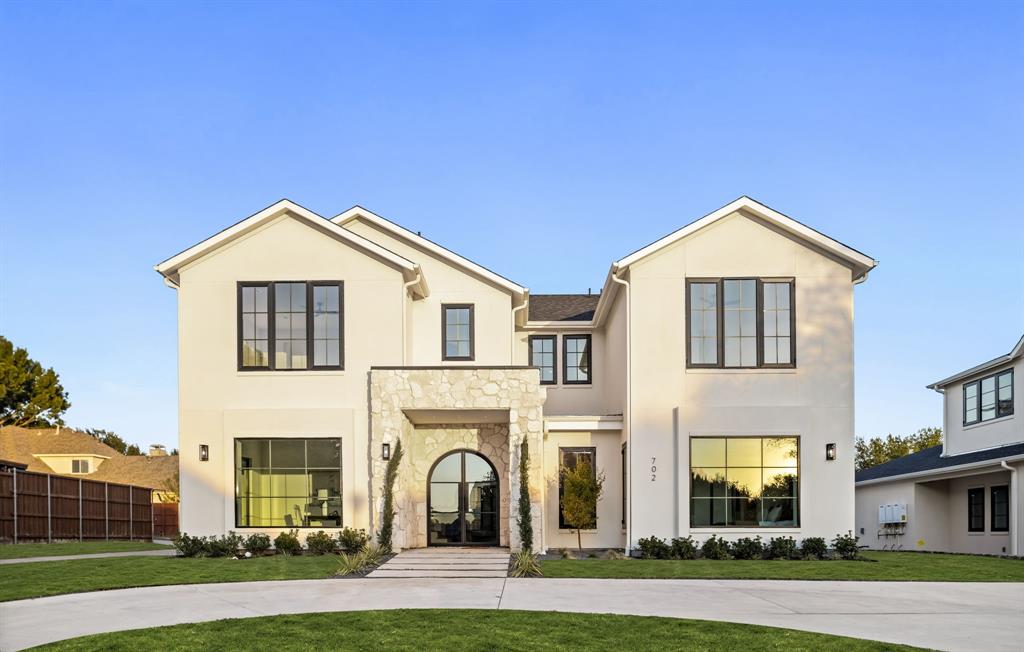 702 Mockingbird Lane Coppell, TX 75019 - Photo 29 of 32 View of front of property with stucco siding and stone siding