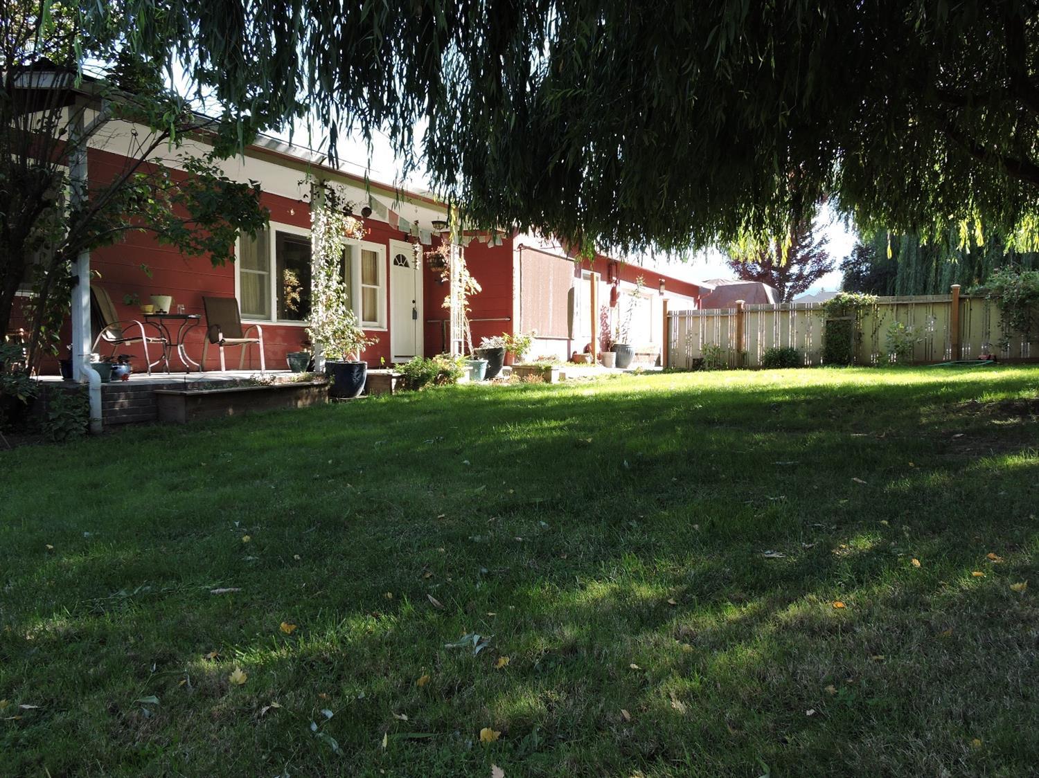 a view of a house with a big yard