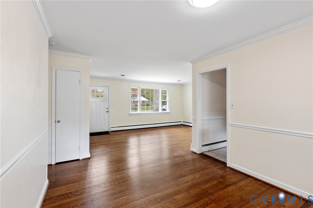 9303 Edson Road Henrico, VA 23229 - Photo 11 of 31 an empty room with wooden floor and windows