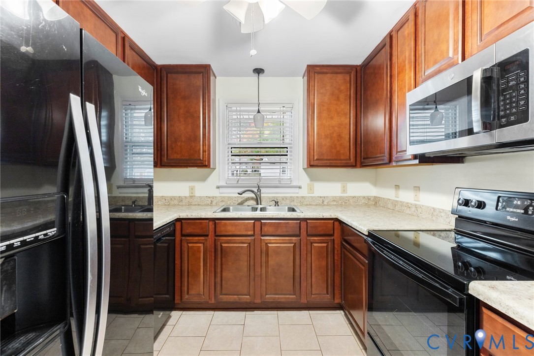 9303 Edson Road Henrico, VA 23229 - Photo 12 of 31 a kitchen with stainless steel appliances granite countertop a sink stove and refrigerator