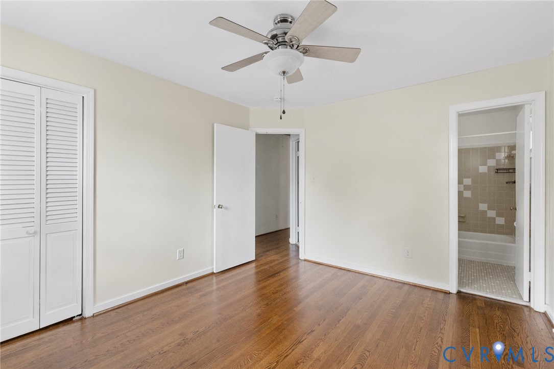 9303 Edson Road Henrico, VA 23229 - Photo 24 of 31 an empty room with wooden floor ceiling fan and windows