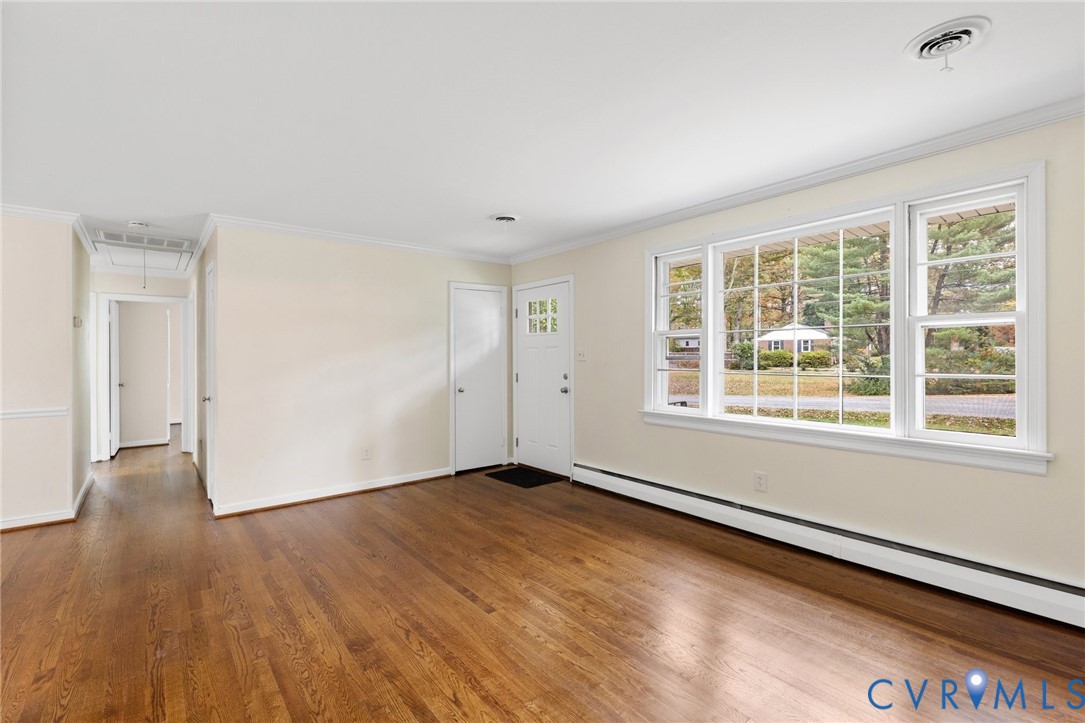 9303 Edson Road Henrico, VA 23229 - Photo 6 of 31 an empty room with wooden floor and windows