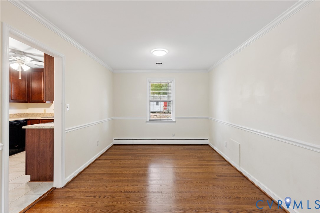 9303 Edson Road Henrico, VA 23229 - Photo 10 of 31 a view of a hallway with wooden floor and a living room