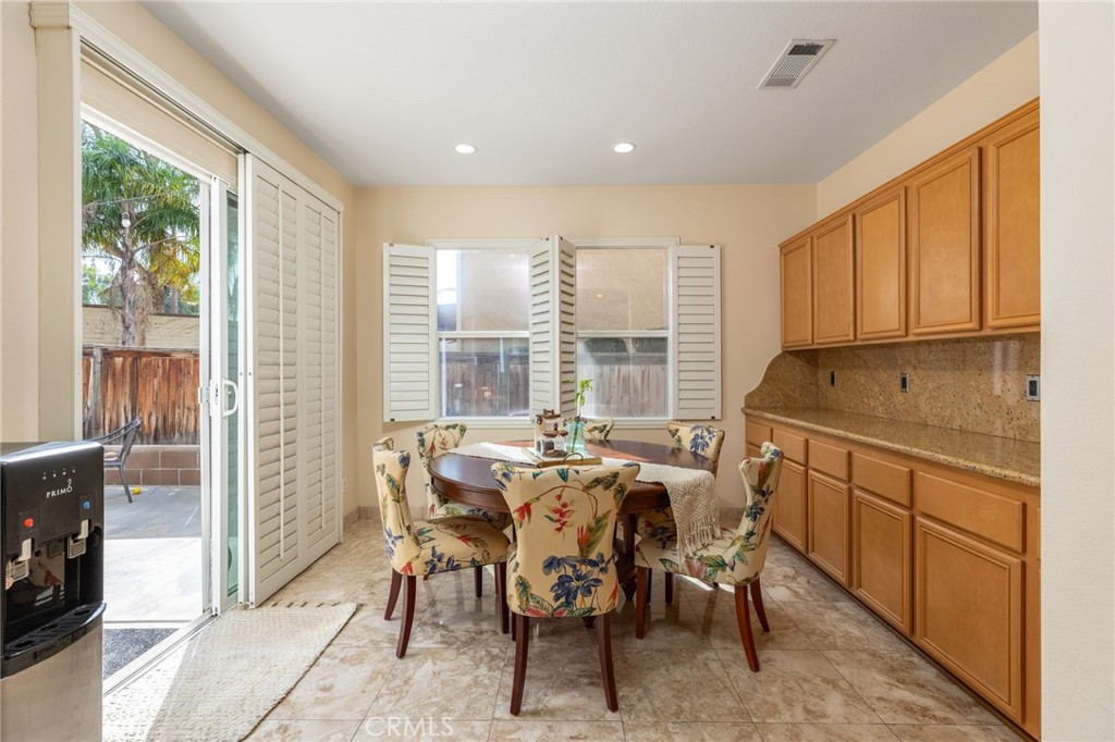 13490 Hawthorn Avenue Moreno Valley, CA 92553 - Photo 13 of 34 a view of a dining room with furniture window and outside view