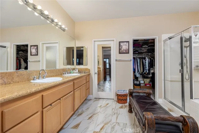 a kitchen with a refrigerator and a stove top oven