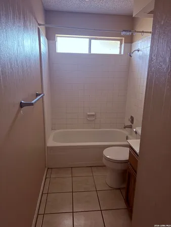 a bathroom with a toilet a sink and bathtub