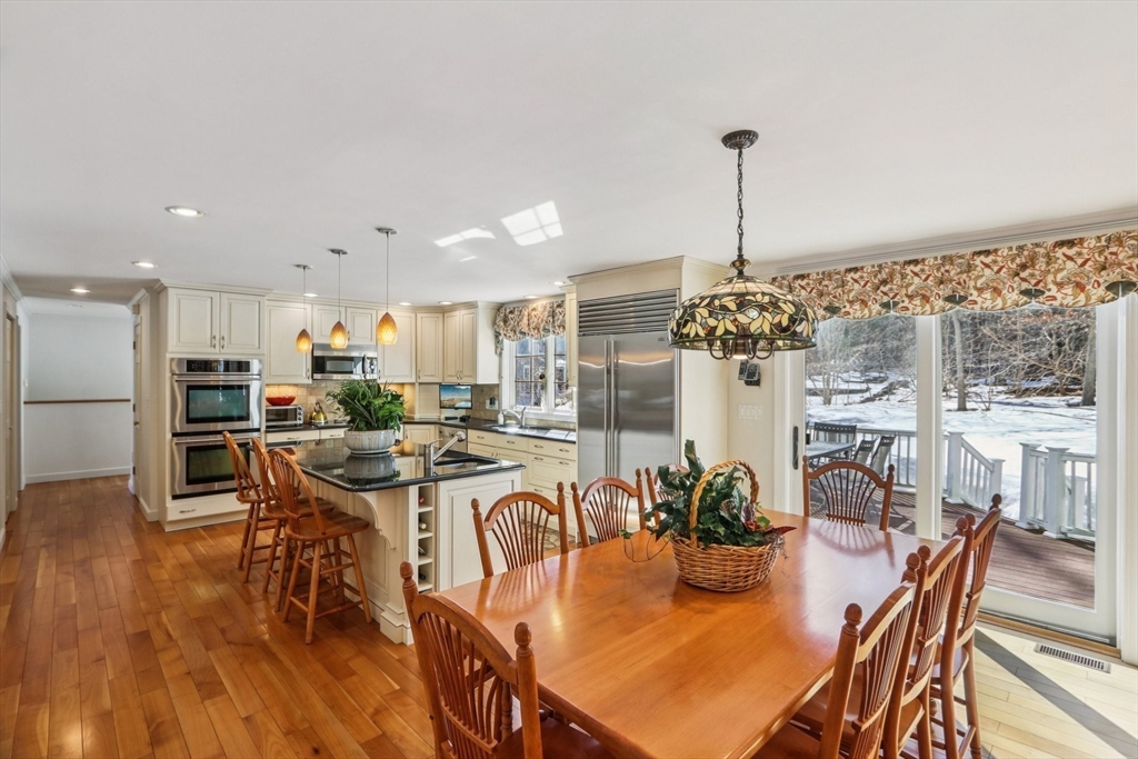 11 Thaxton Road Beverly, MA 01915 - Photo 1 of 40 a dining room with furniture a chandelier and wooden floor