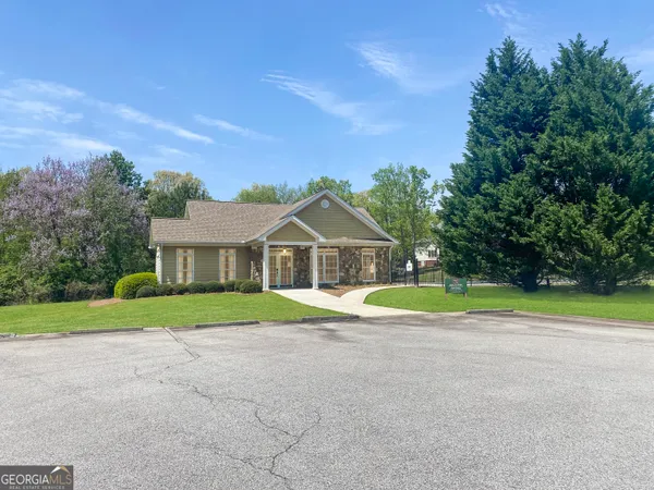 a house with trees in the background