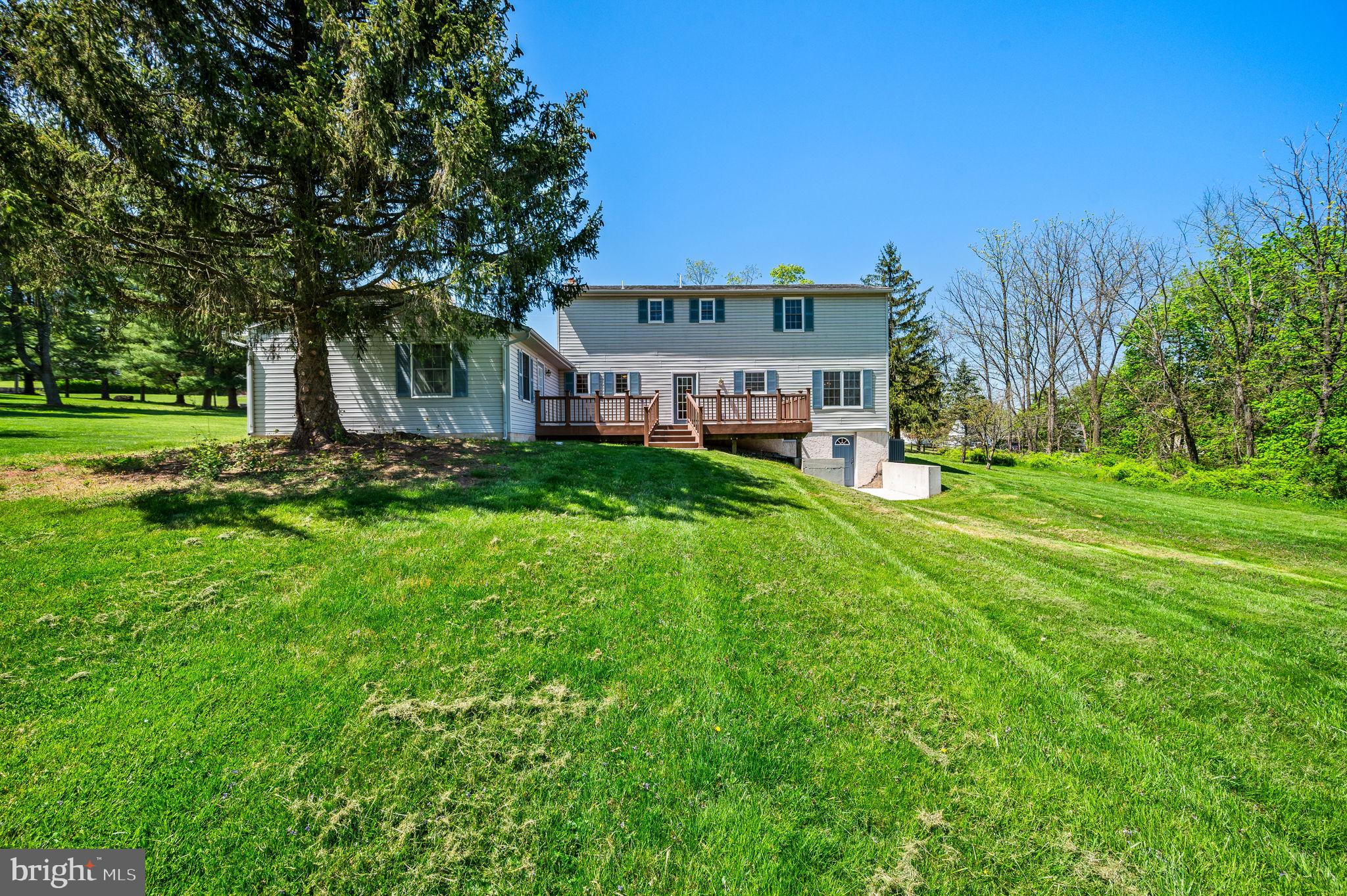 1094 Ebelhare Road Pottstown, PA 19465 - Photo 11 of 45 a view of a house with a big yard and large trees