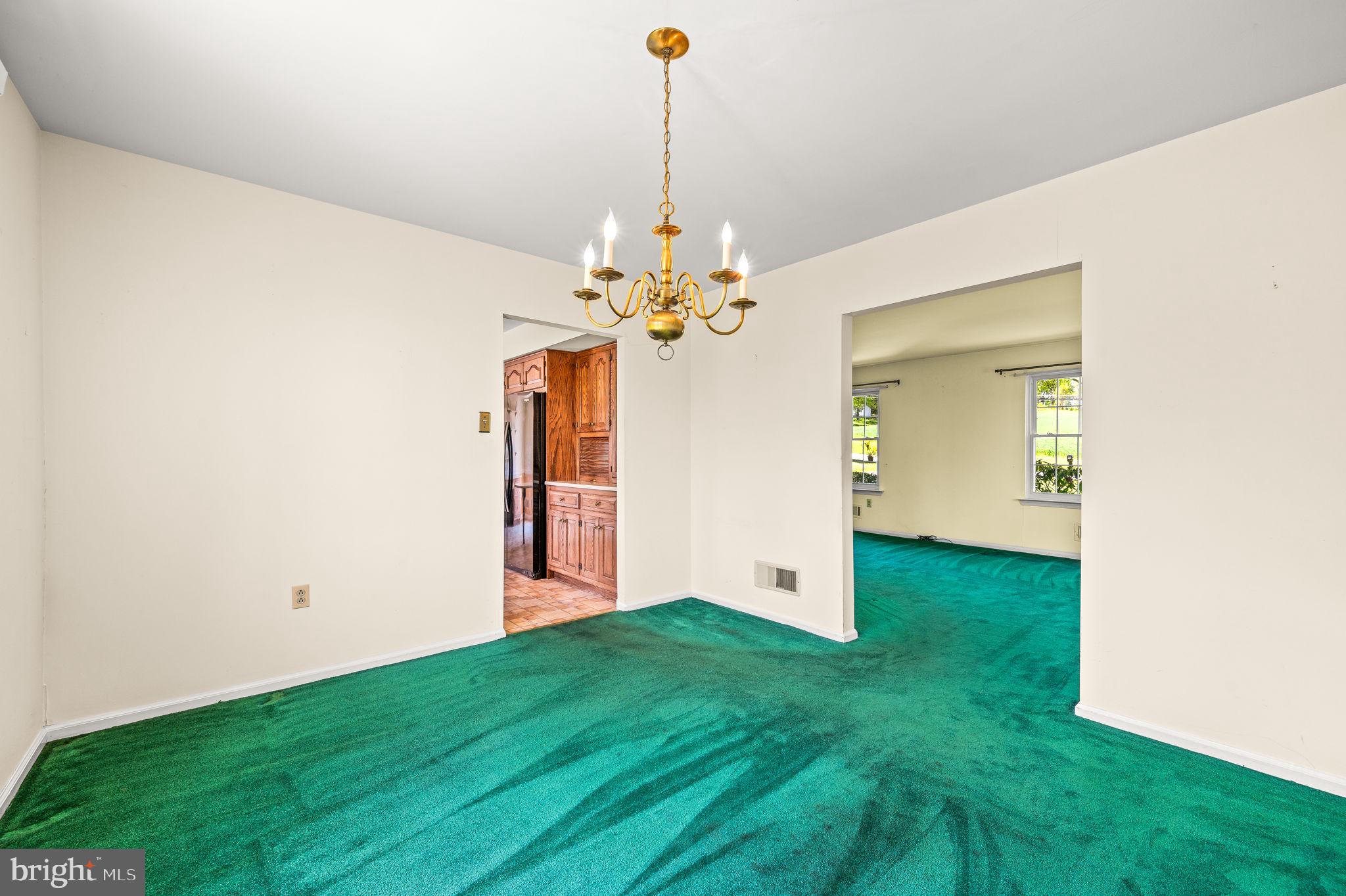 1094 Ebelhare Road Pottstown, PA 19465 - Photo 17 of 45 a view of a room with a chandelier fan and wooden floor